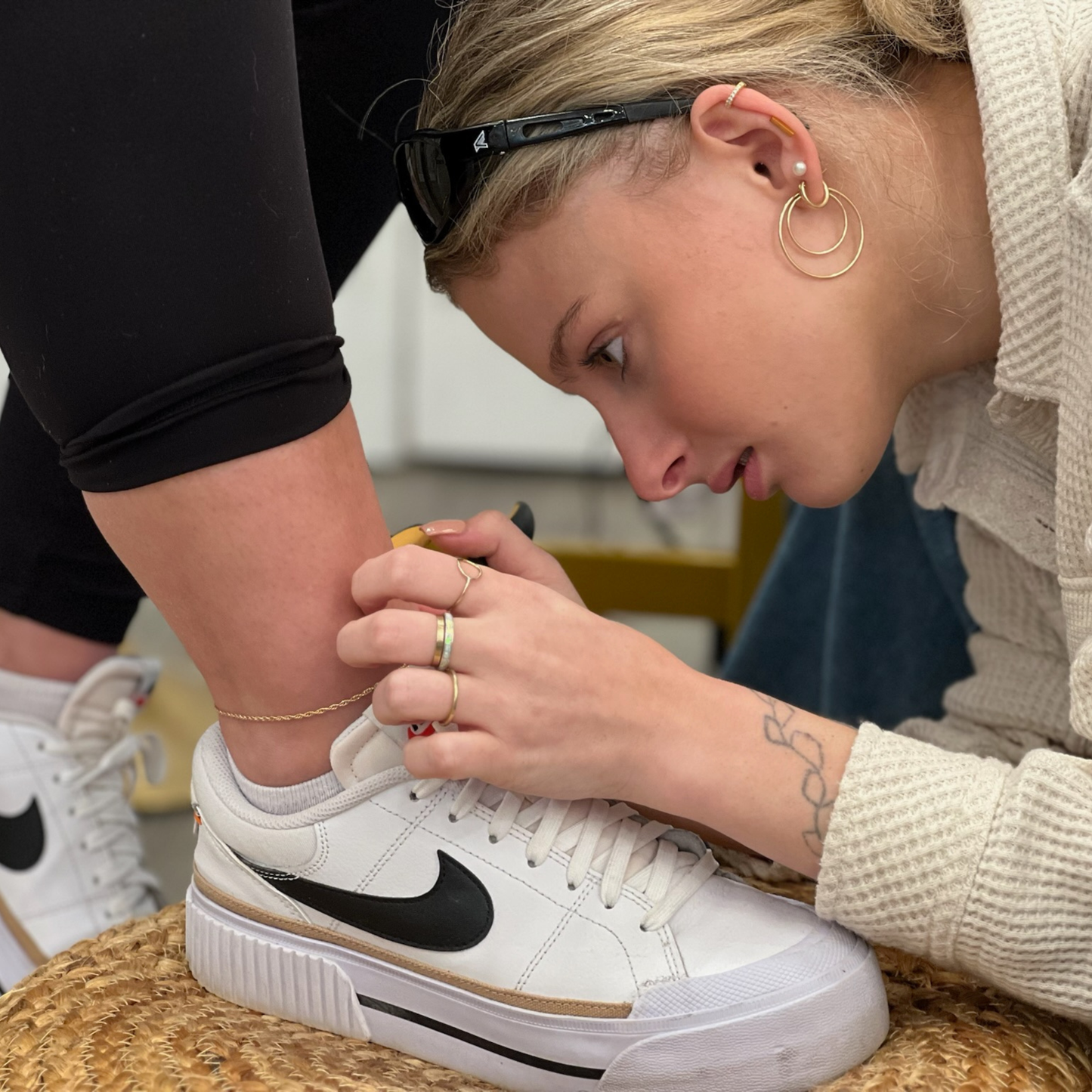 Person sizing chain for a permanent jewelry anklet.