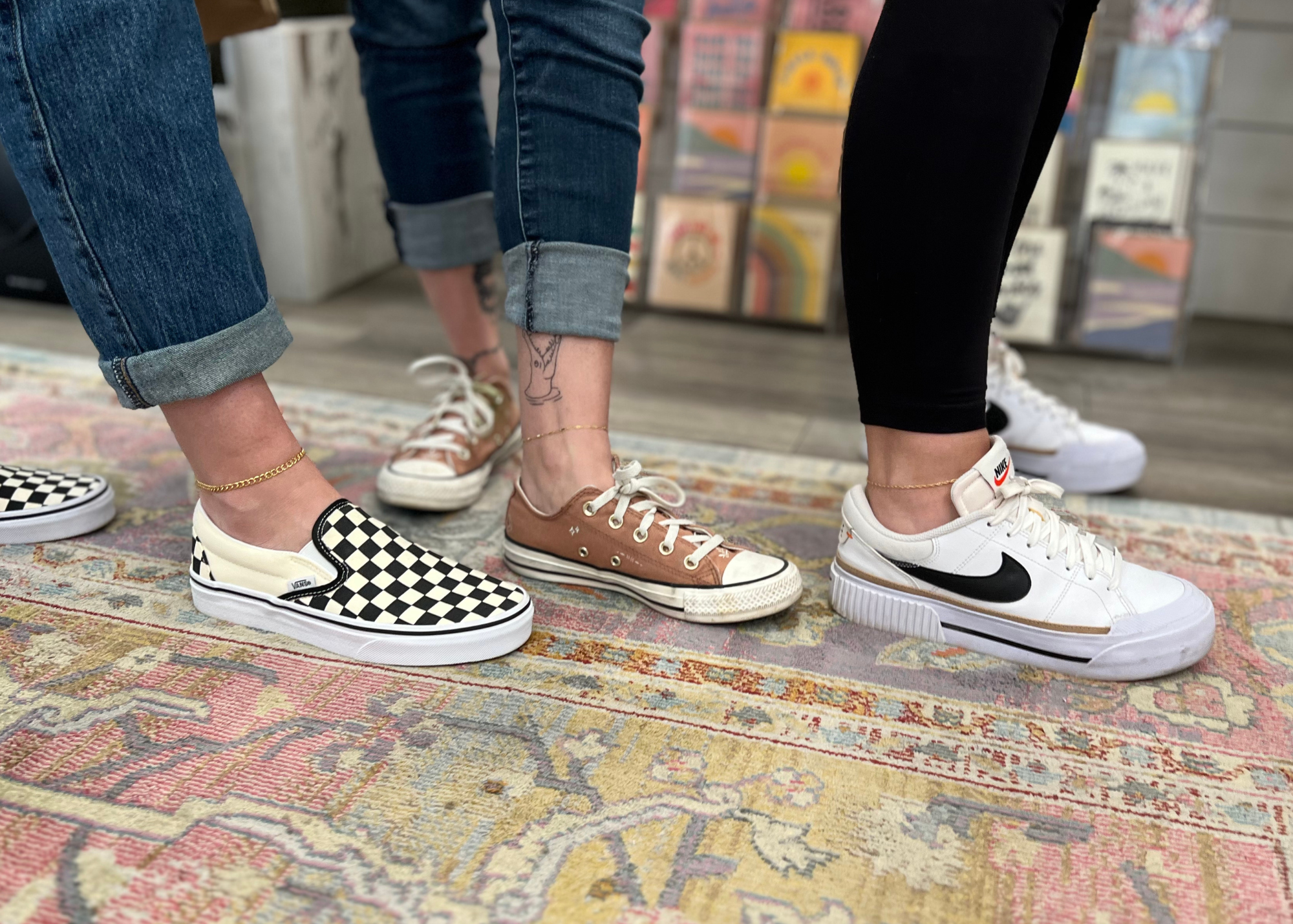 Friends getting permanent jewelry anklets together.