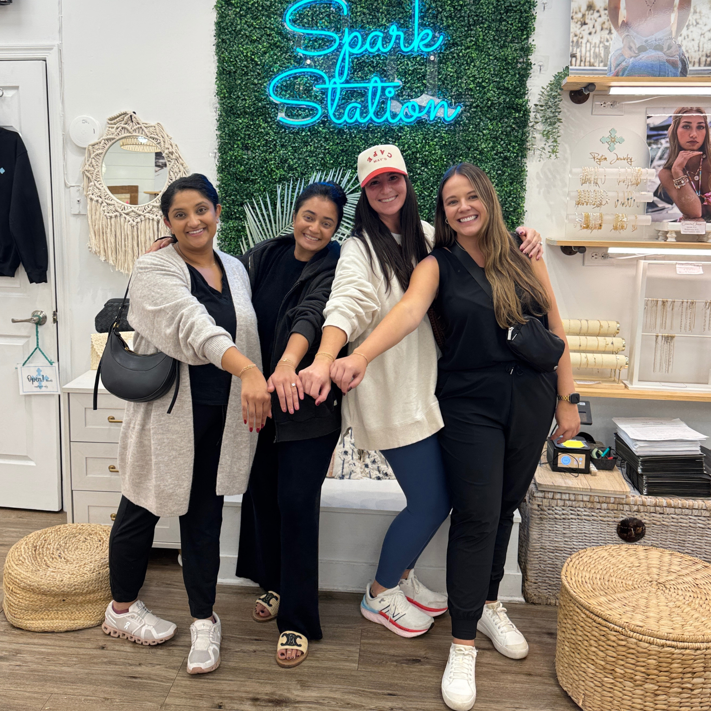 Four women posing together, showing off their Payton Unbreakable Bond Permanent bracelets. 