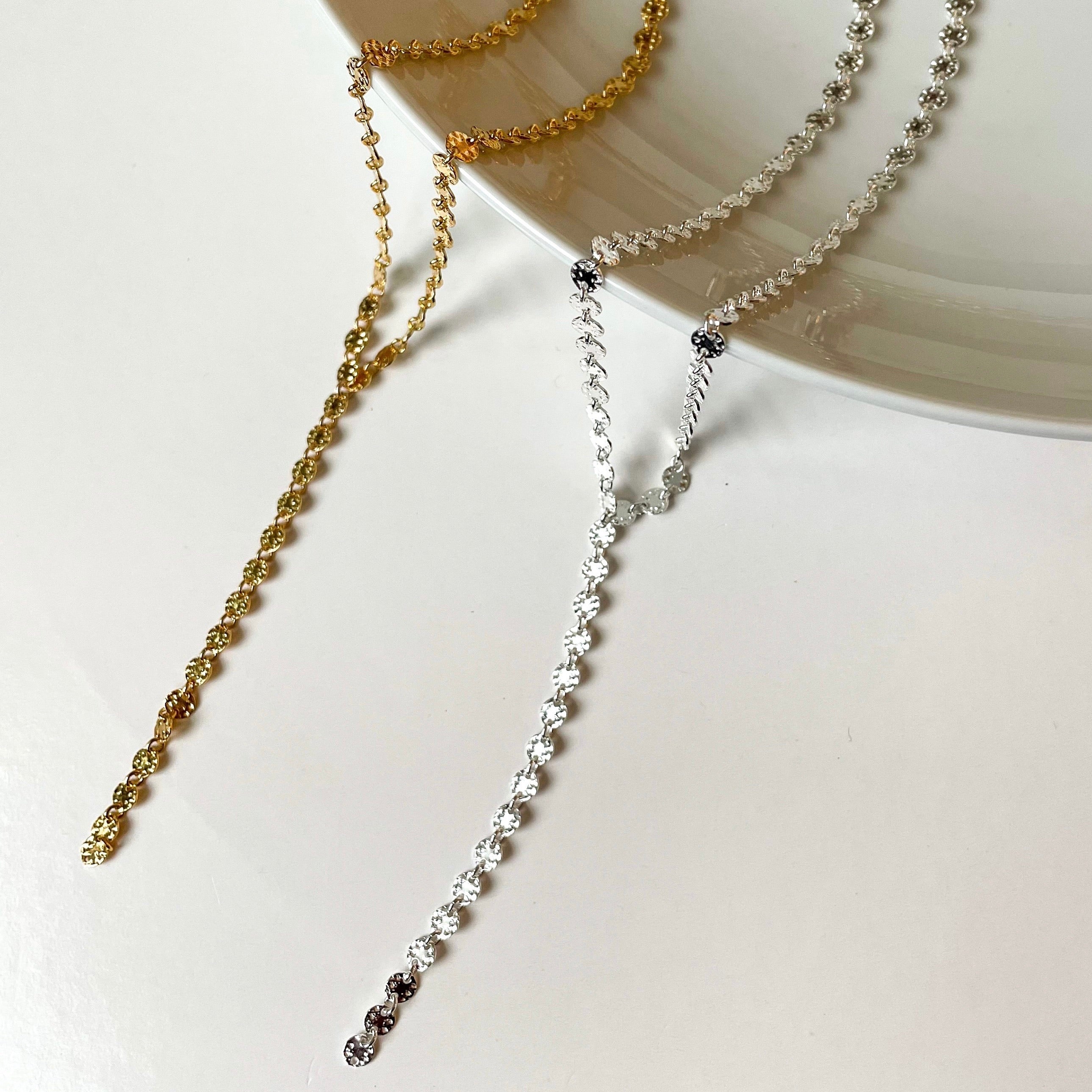 our most popular coin drop necklace shown in silver and gold.