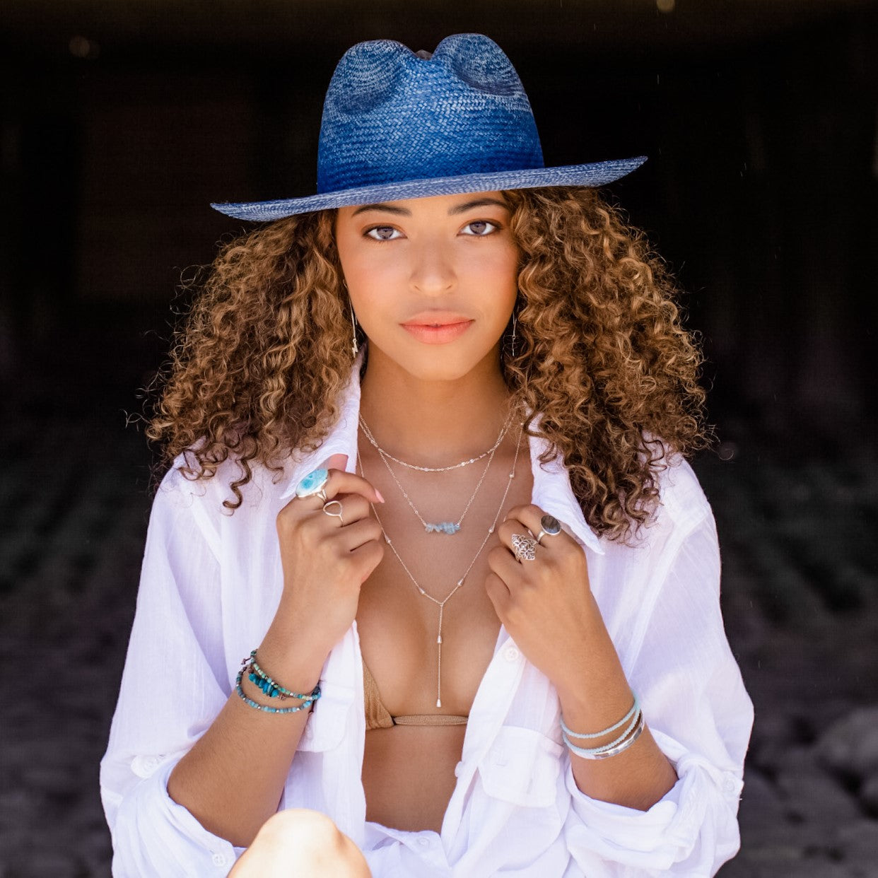 silver jetsetter drop necklace layered with seabreeze necklace and dainty chain necklace.