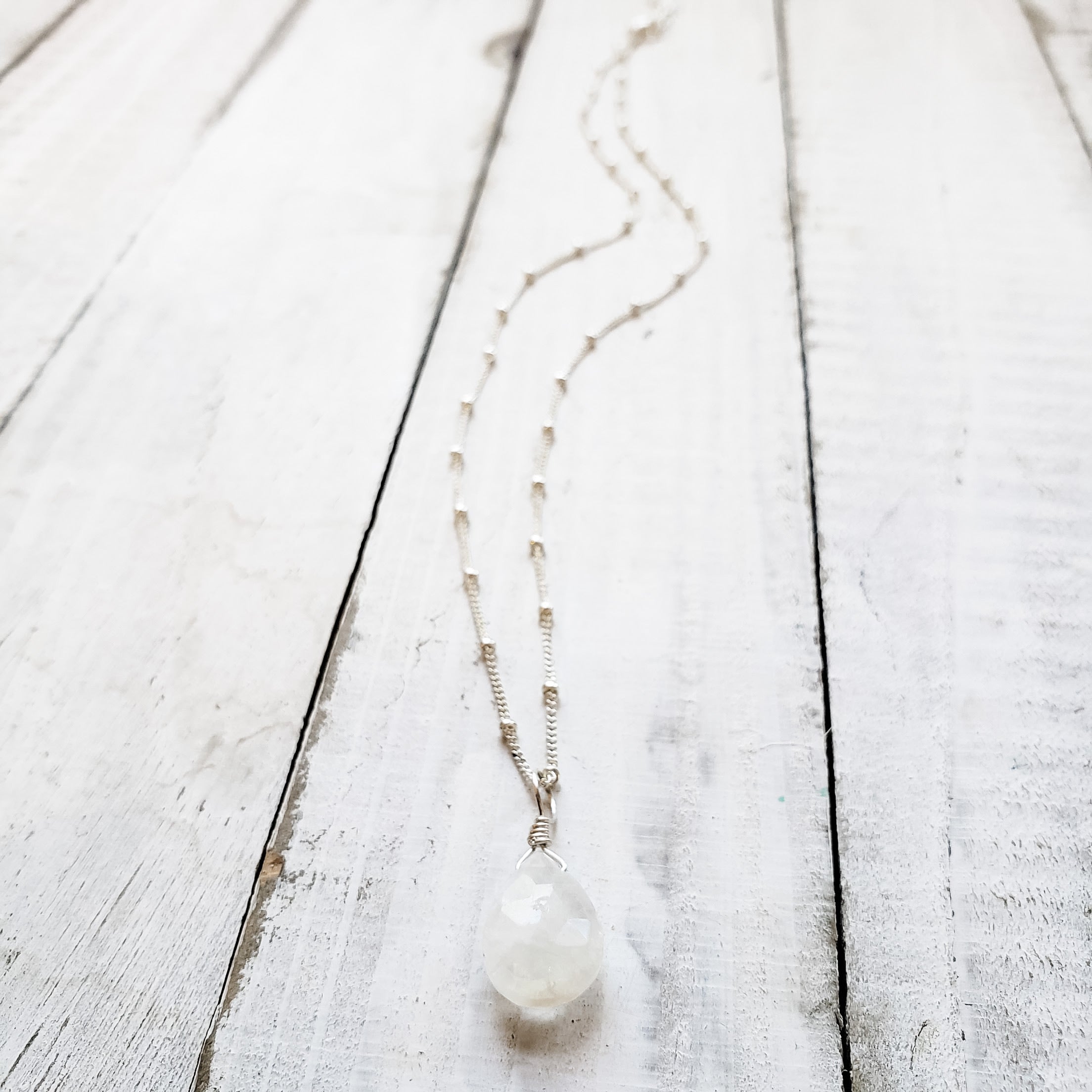 silver necklace with moonstone gemstone pendant.