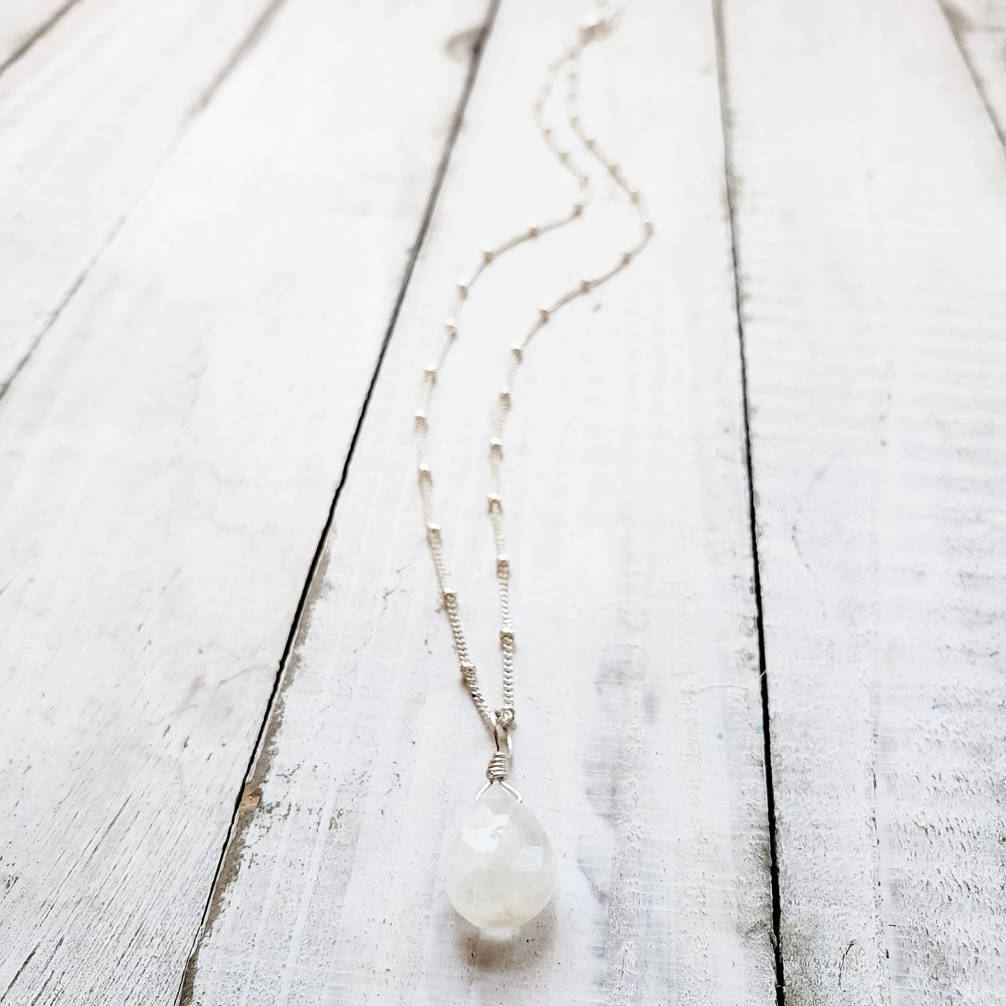 silver necklace with moonstone gemstone pendant.